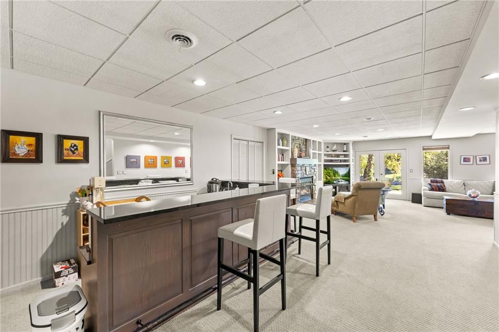 Wainscoting or board and batten and wet bar at 4503 NE Waters Edge Street, Lee's Summit, MO 64064