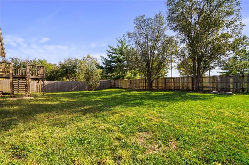Big backyard, mature trees and flat lot at 2513 SE WINCHESTER Drive, Lee's Summit, MO 64063