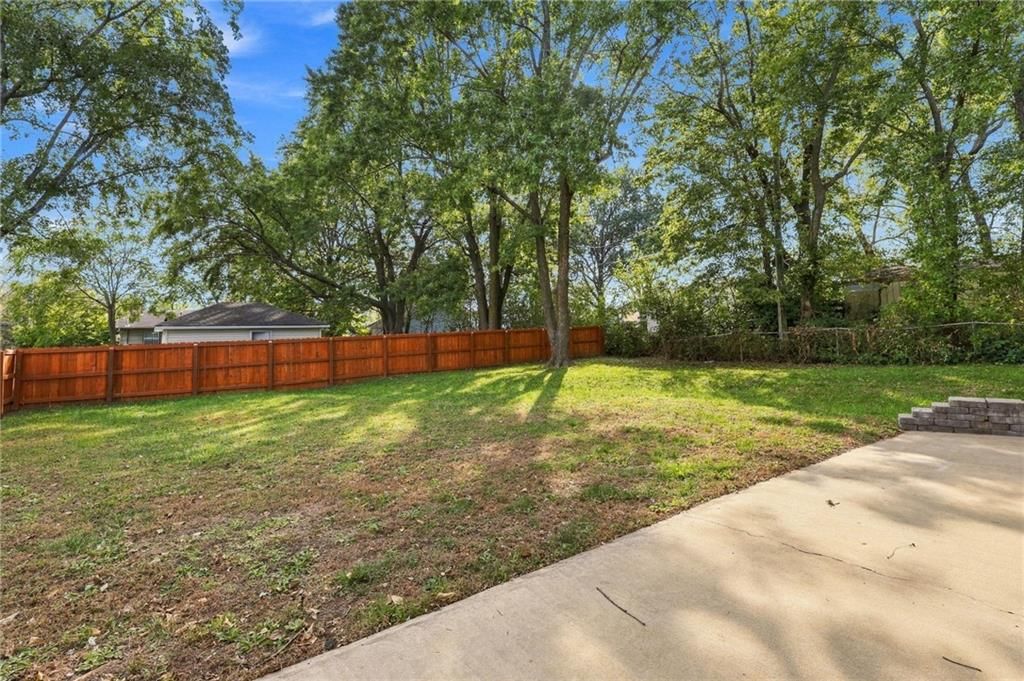 Big backyard, fenced yard and mature trees at 311 E Washington Street, Gardner, KS 66030