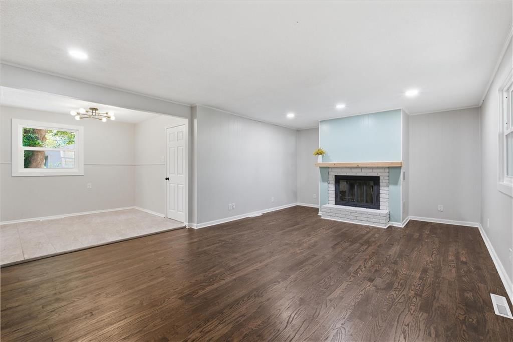 Fireplace, hardwood floors and tile fireplace at 8503 Crystal Avenue, Kansas City, MO 66209