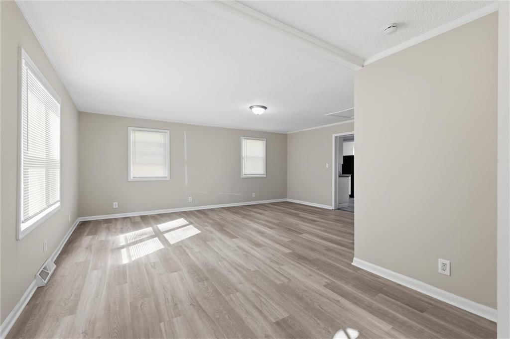 Luxury vinyl floors, white trim and gray walls at 10030 E 22ND Street, Independence, MO 64052