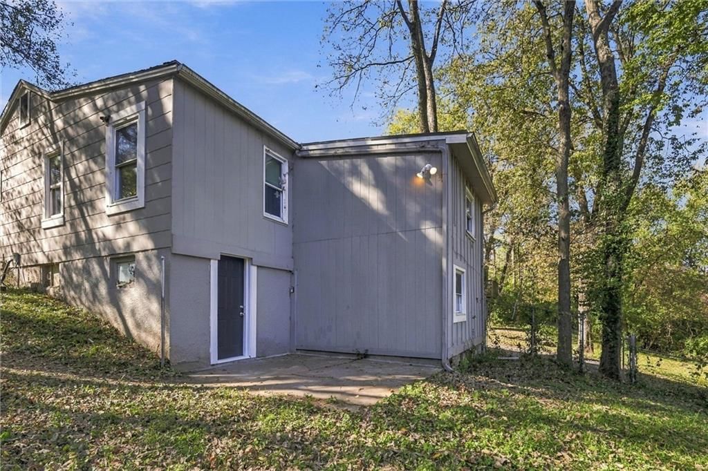 Mature trees, concrete patio and flat lot at 10030 E 22ND Street, Independence, MO 64052