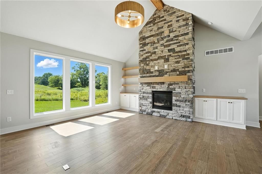 Fireplace and stone fireplace at 4368 Tee Box Drive, Basehor, KS 66007
