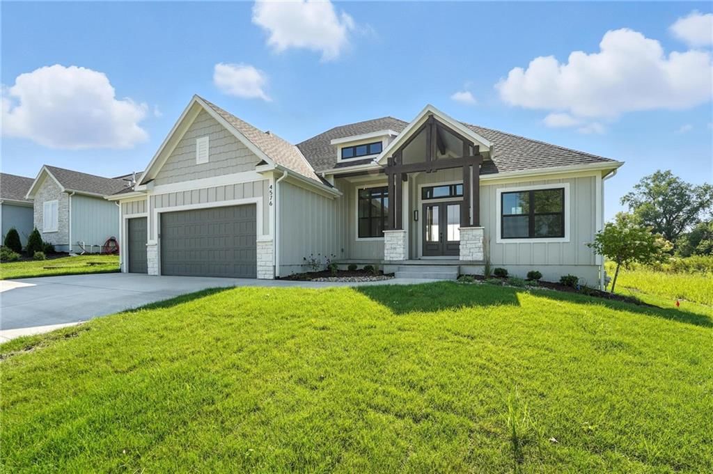 Gray roof, asphalt shingle roof and two-tone exterior at 4368 Tee Box Drive, Basehor, KS 66007