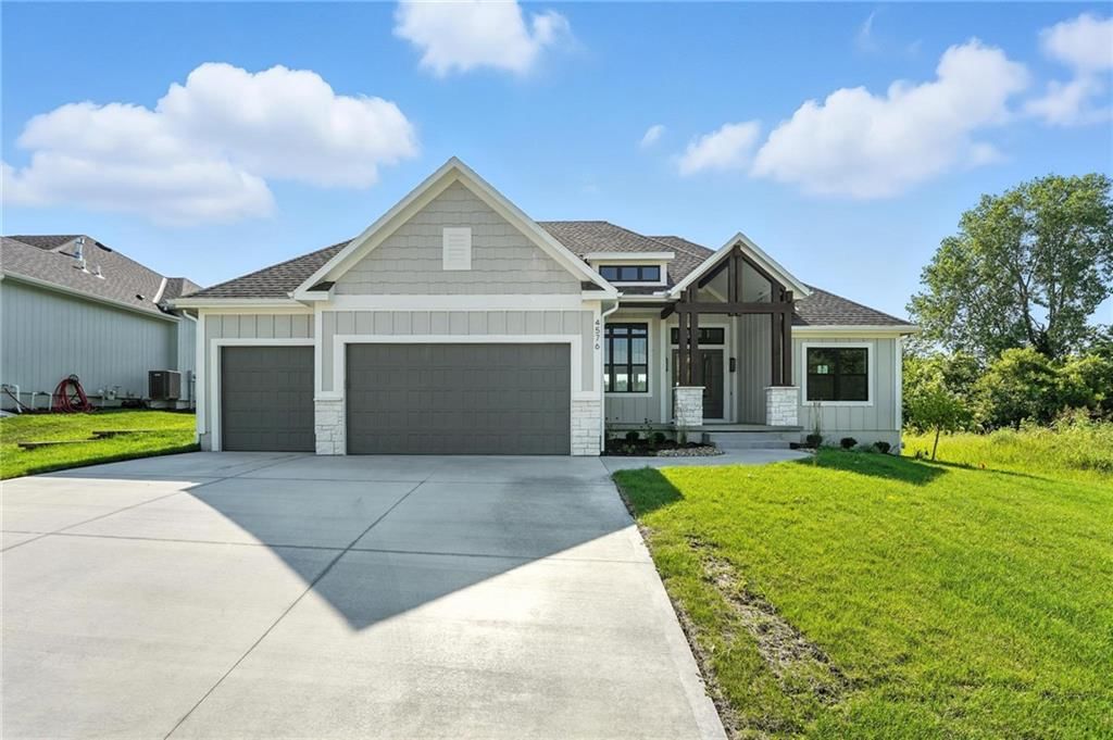 Garage for three or more cars, attached garage and concrete driveway at 4368 Tee Box Drive, Basehor, KS 66007