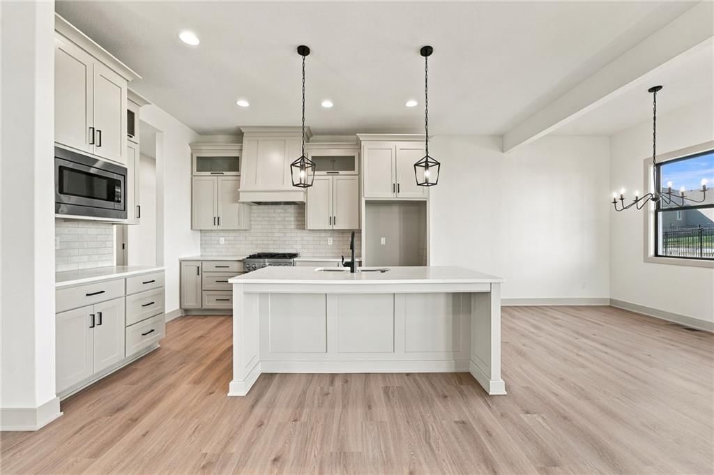 Quartz counters and kitchen backsplash at 2605 NE Crestview Street, Blue Springs, MO 64029