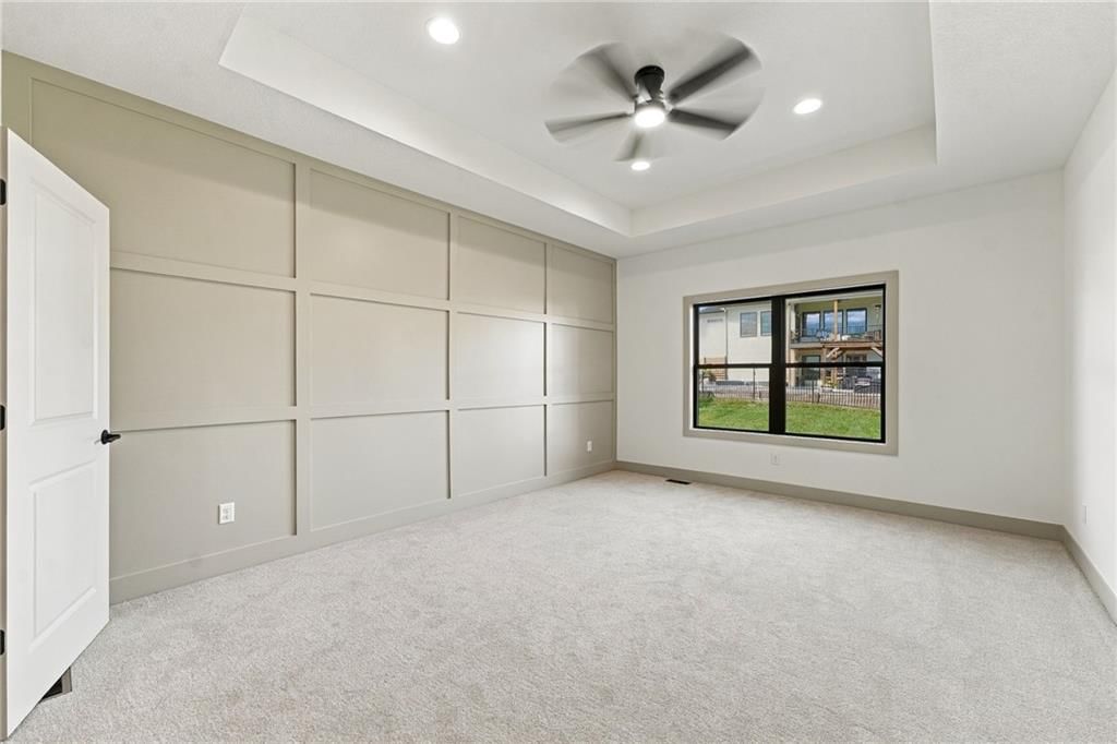Main-floor primary bedroom and tray ceiling at 2605 NE Crestview Street, Blue Springs, MO 64029