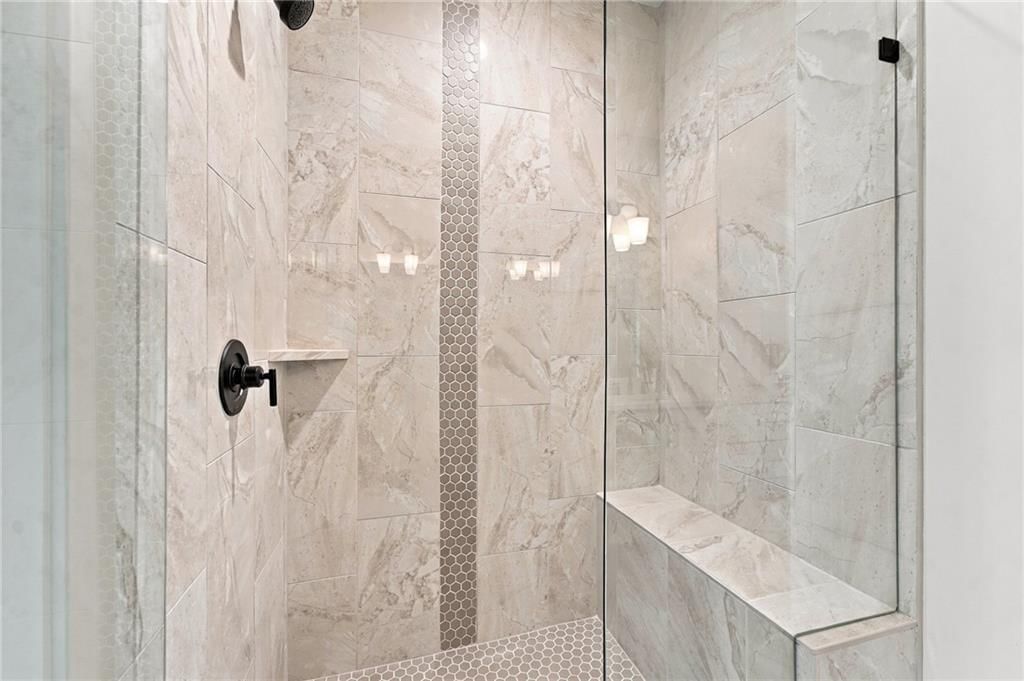 Walk-in shower, tiled shower and frameless glass shower at 2605 NE Crestview Street, Blue Springs, MO 64029