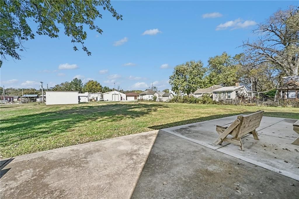 Big backyard and flat lot at 190 4th Street, Holt, MO 64048