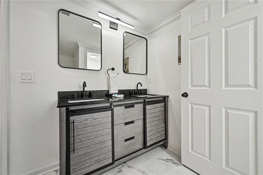 Double vanity and renovated bathrooms at 190 4th Street, Holt, MO 64048