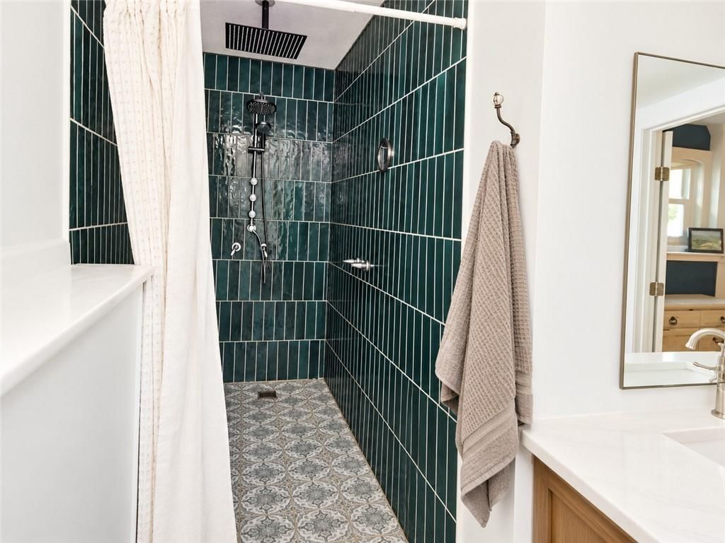 Walk-in shower and tiled shower at 14090 Walker Road, Kansas City, MO 64163