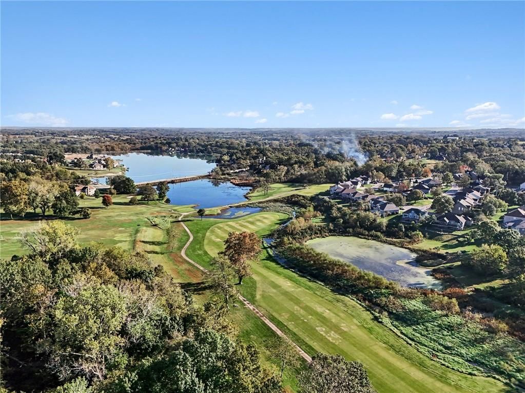Golf course visible from the property and pond or creek visible on the lot at 12554 Prestwick Lane, Kansas City, KS 66109