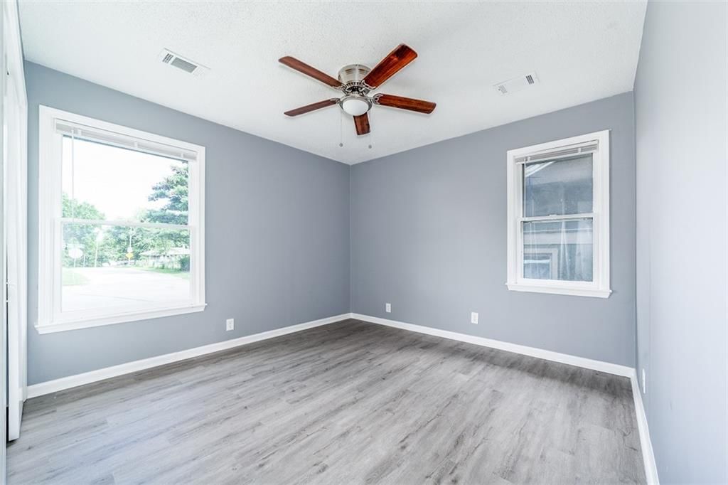 Main-floor primary bedroom at 8234 Paseo Boulevard, Kansas City, MO 64131
