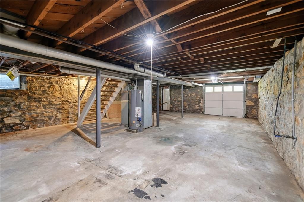 Staircase and attached garage at 2216 NE 39th Terrace, Kansas City, MO 64116