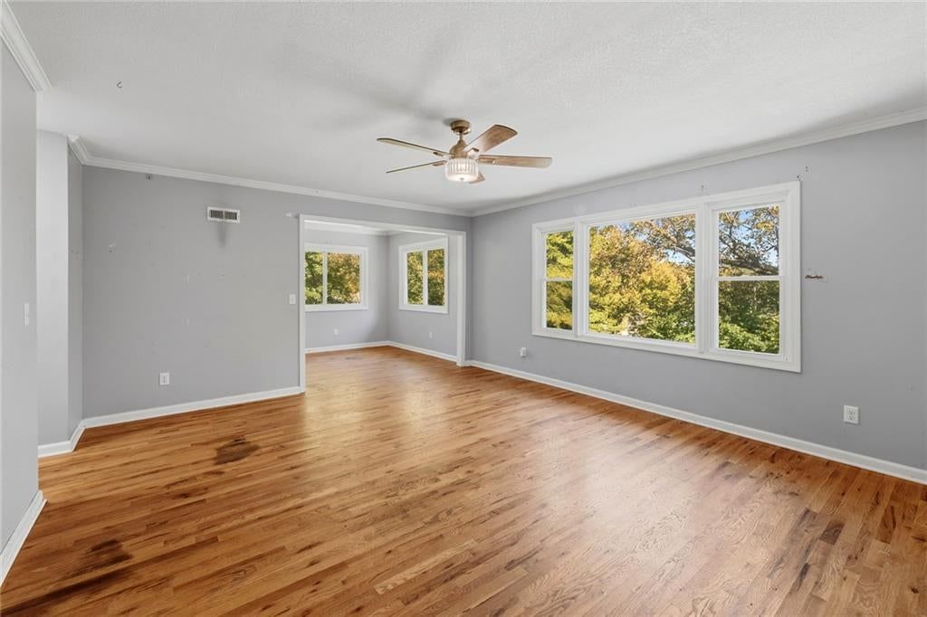 Hardwood floors, white trim and gray walls at 2216 NE 39th Terrace, Kansas City, MO 64116