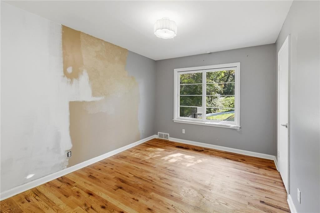 Main-floor primary bedroom at 2216 NE 39th Terrace, Kansas City, MO 64116