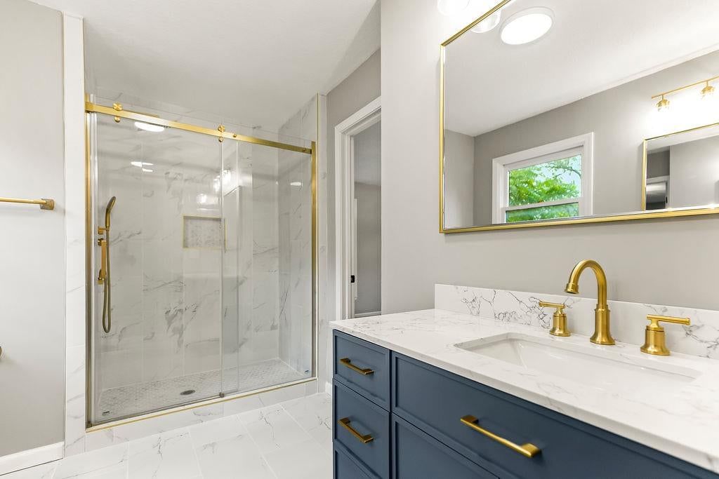Walk-in shower, tiled shower and frameless glass shower at 13811 West 48th Street, Shawnee, KS 66217