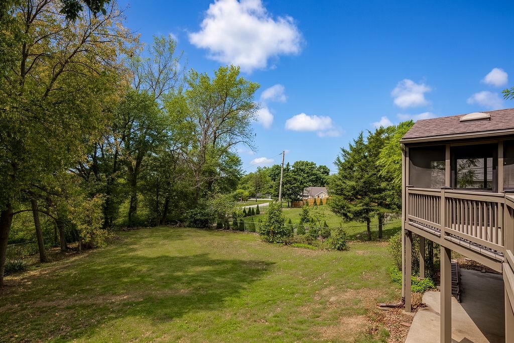 Big backyard, mature trees and flat lot at 13811 West 48th Street, Shawnee, KS 66217