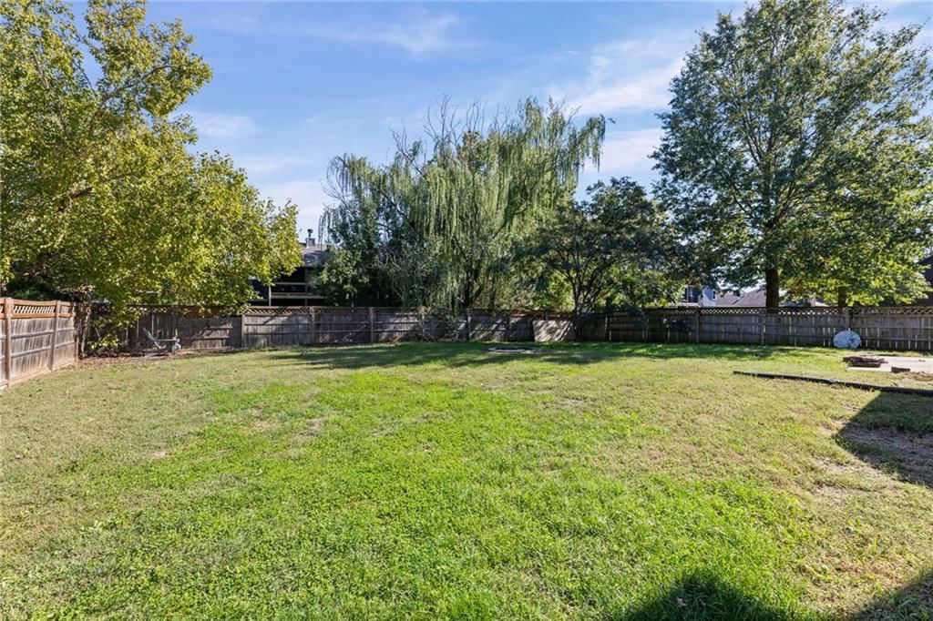 Big backyard, fenced yard and wood fence at 18417 ELM Street, Gardner, KS 66030