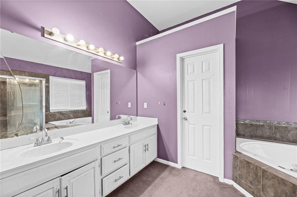 Freestanding tub and renovated bathrooms at 18417 ELM Street, Gardner, KS 66030
