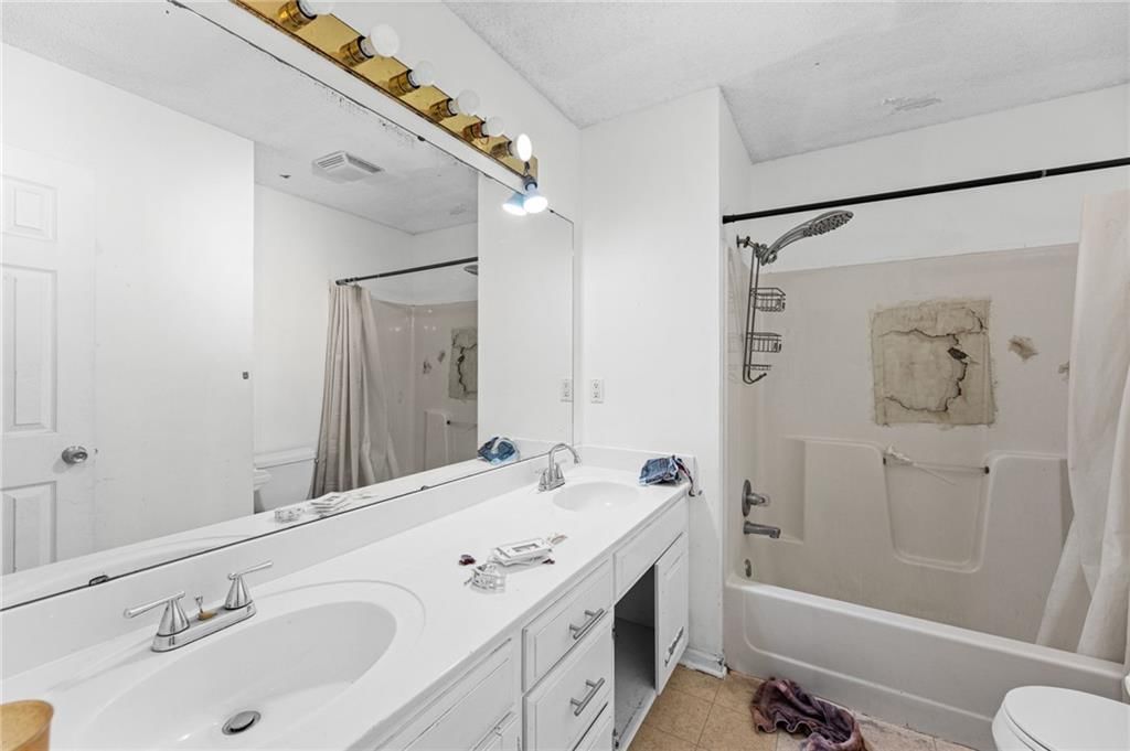 Double vanity and tub and shower combo at 18417 ELM Street, Gardner, KS 66030