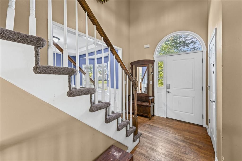 Hardwood floors, staircase and wood stair railing at 18417 ELM Street, Gardner, KS 66030