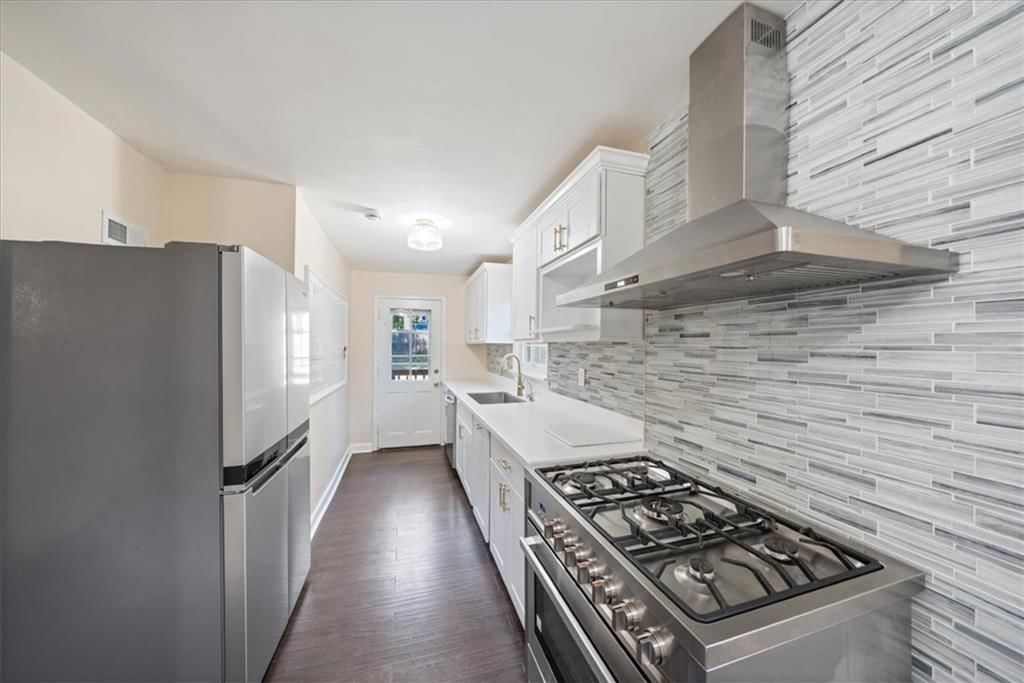 Gas range and stainless steel appliances at 2216 Nebraska Avenue, Kansas City, KS 66102