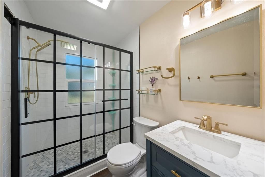 Tiled shower, frameless glass shower and renovated bathrooms at 2216 Nebraska Avenue, Kansas City, KS 66102