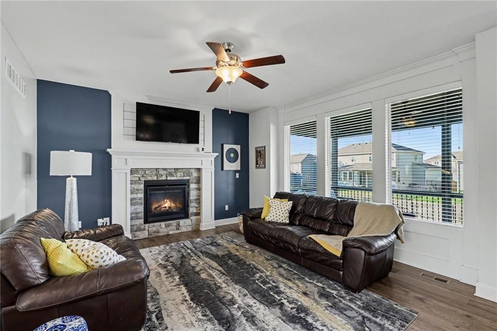 Fireplace, stone fireplace and wall of windows at 16046 W 172nd Terrace, Olathe, KS 66062