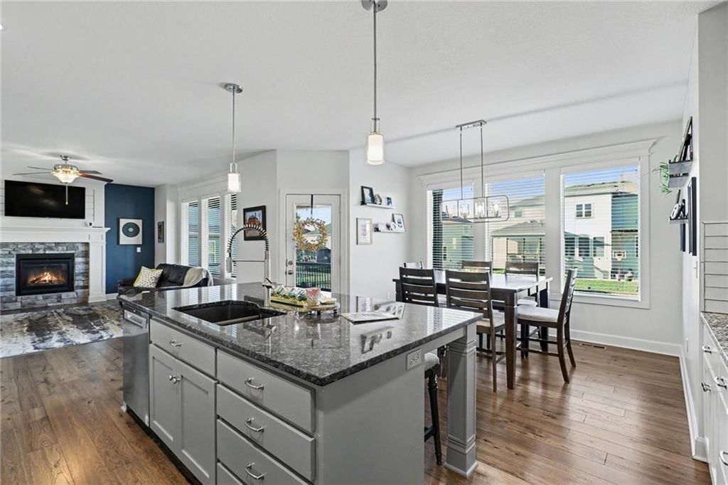 Kitchen island, granite counters and black countertops at 16046 W 172nd Terrace, Olathe, KS 66062
