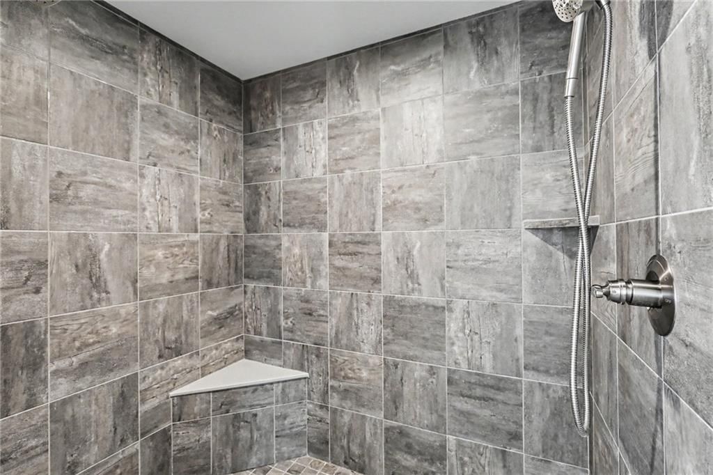 Walk-in shower and tiled shower at 16046 W 172nd Terrace, Olathe, KS 66062