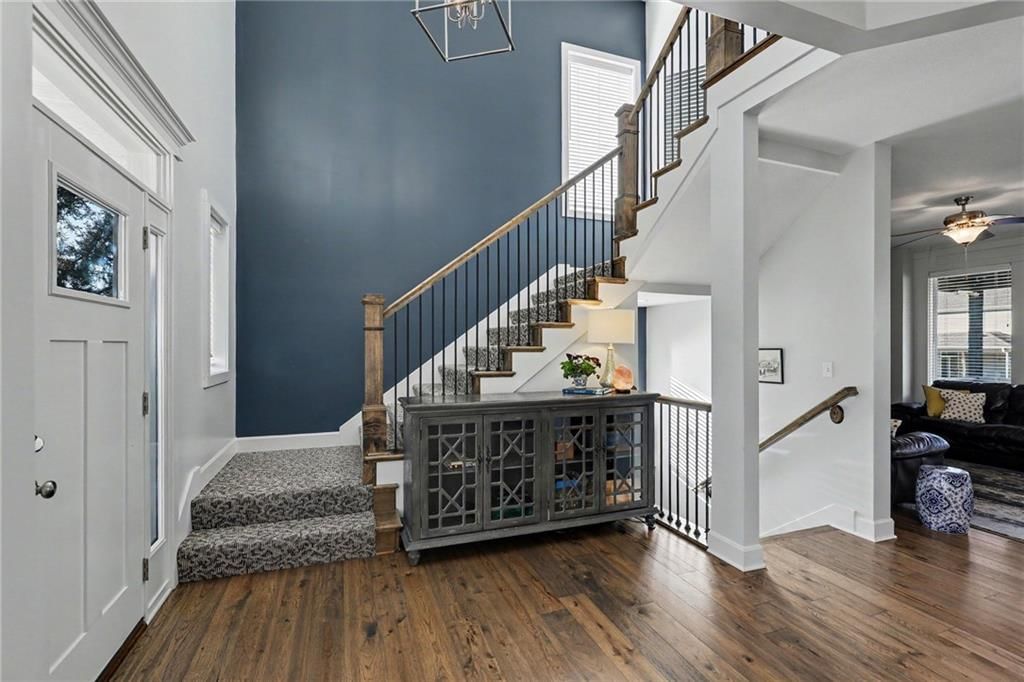 Hardwood floors, staircase and iron stair railing at 16046 W 172nd Terrace, Olathe, KS 66062