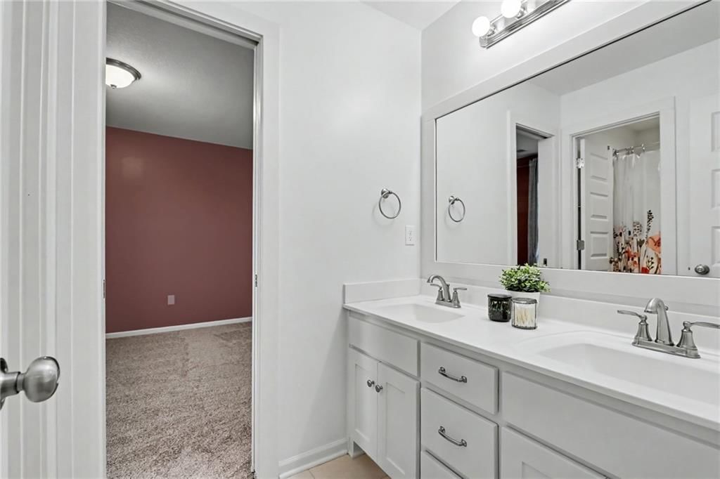 Double vanity, white vanity and renovated bathrooms at 16046 W 172nd Terrace, Olathe, KS 66062