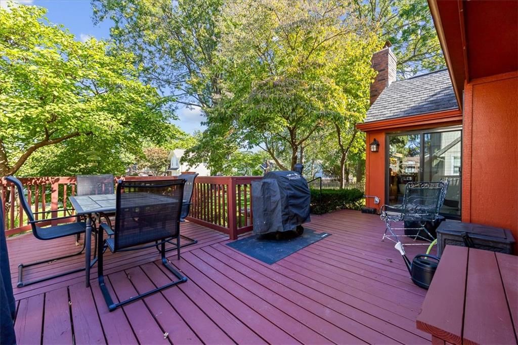Deck, big backyard and mature trees at 204 NW Cypress Street, Lee's Summit, MO 64064