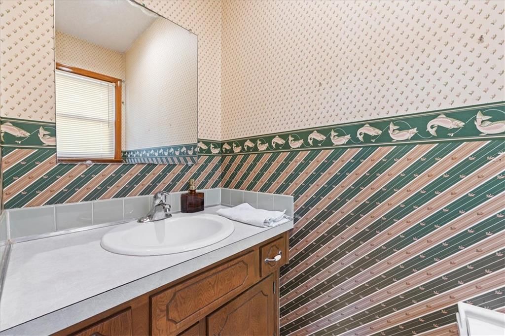Wainscoting or board and batten, double vanity and wood vanity at 204 NW Cypress Street, Lee's Summit, MO 64064