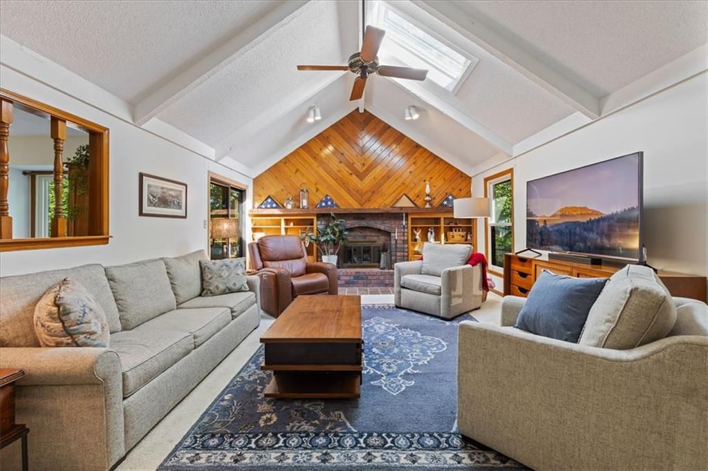 Tall ceilings, fireplace and hardwood floors at 204 NW Cypress Street, Lee's Summit, MO 64064