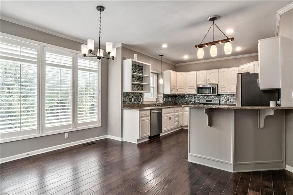Photo 7: white kitchen cabinets, 8910 W 132nd Terrace, Overland Park, KS 66213