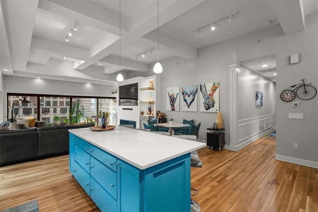 Tall ceilings, open floor plan and hardwood floors at 1101 Walnut Street #609, Kansas City, MO 64106