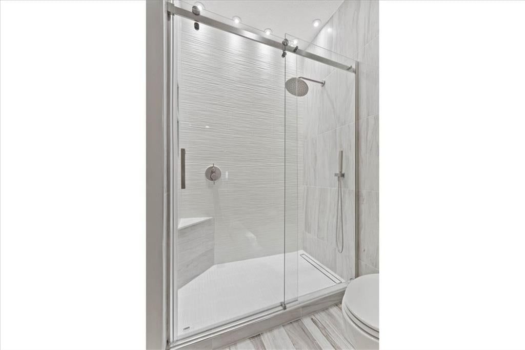 Walk-in shower, tiled shower and frameless glass shower at 1101 Walnut Street #609, Kansas City, MO 64106