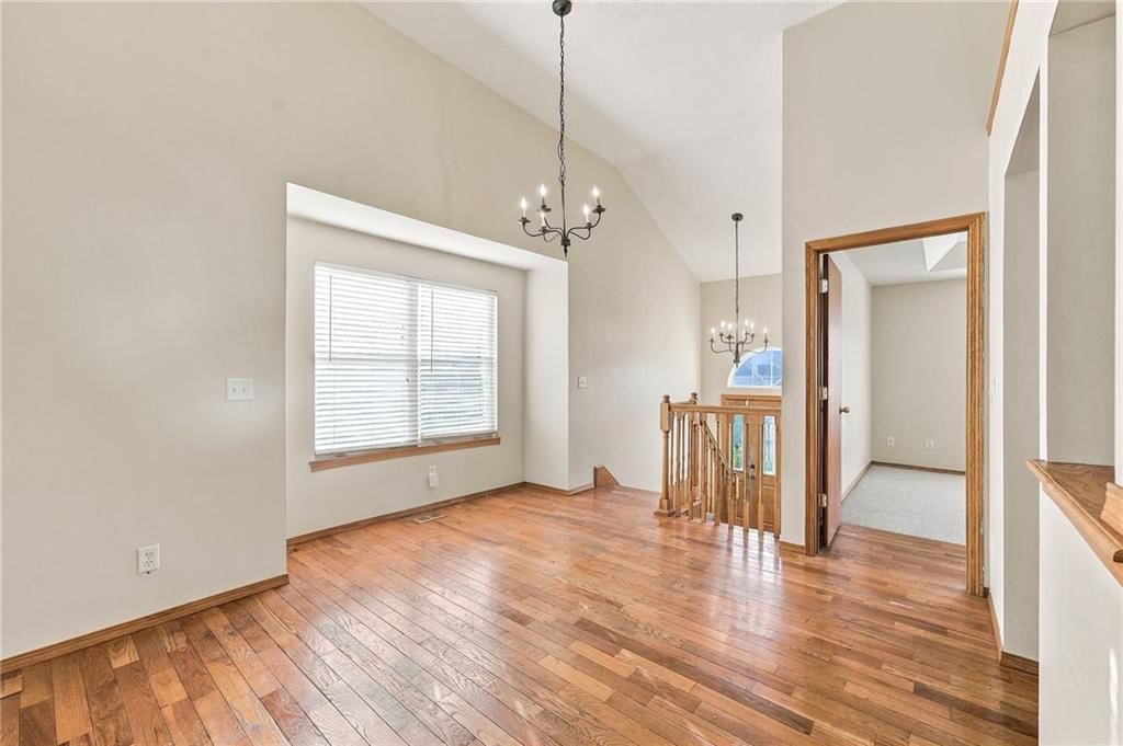 Tall ceilings, hardwood floors and statement lighting at 200 SW Chartwell Drive, Lee's Summit, MO 64082