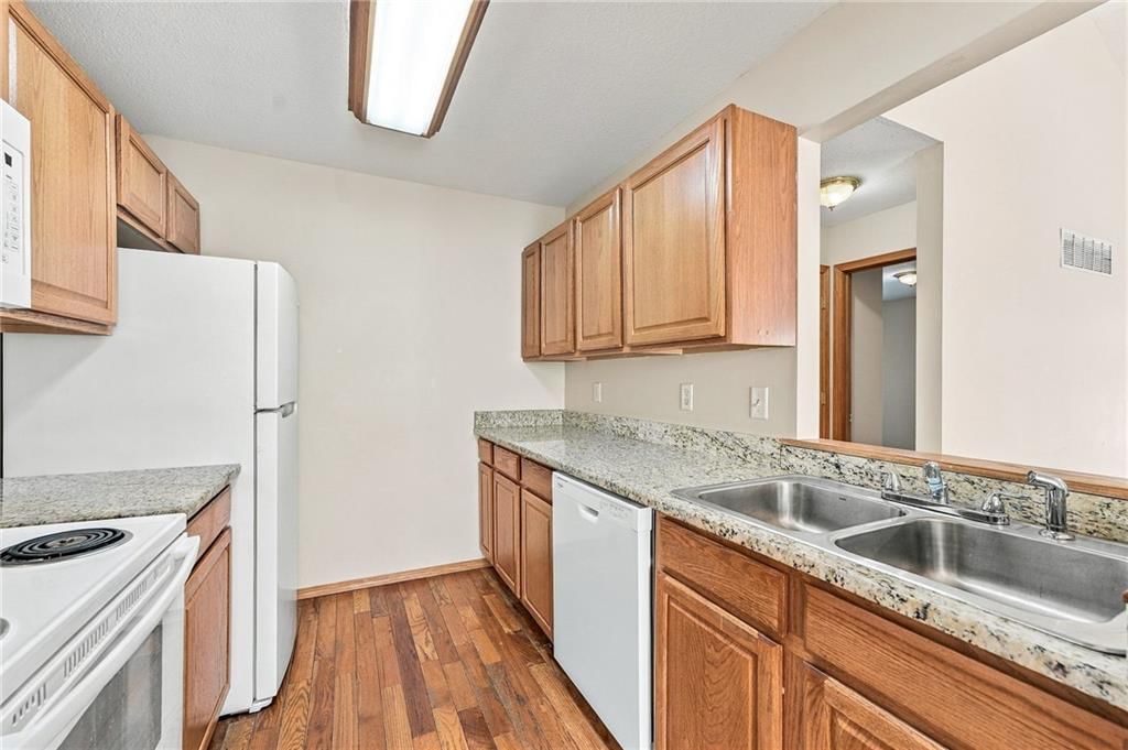 Wood kitchen cabinets at 200 SW Chartwell Drive, Lee's Summit, MO 64082
