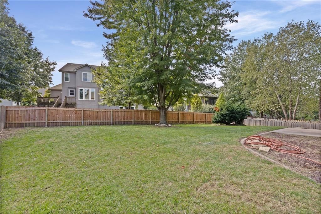 Big backyard and mature trees at 8009 W 144th Place, Overland Park, KS 66223