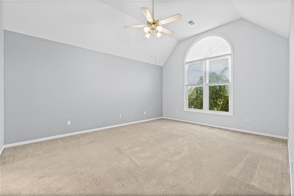 Tall ceilings and carpet at 8009 W 144th Place, Overland Park, KS 66223