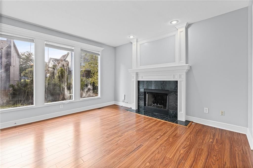 Fireplace and recessed lighting at 8009 W 144th Place, Overland Park, KS 66223