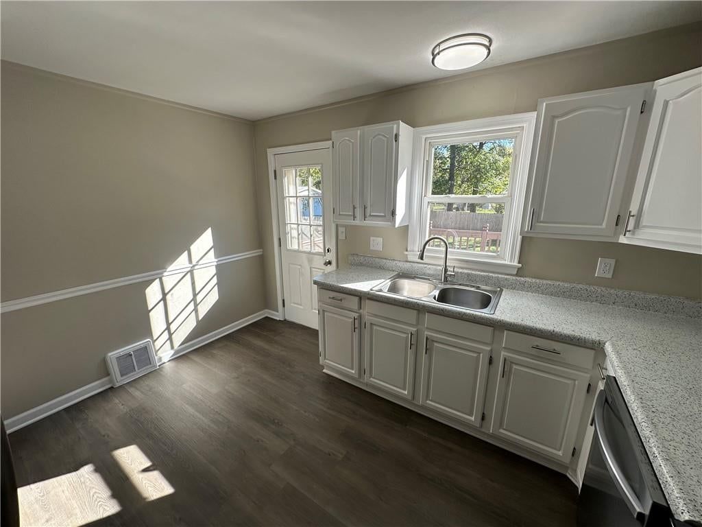 Quartz counters, updated kitchen and kitchen backsplash at 11113 E 25th Street, Independence, MO 64052