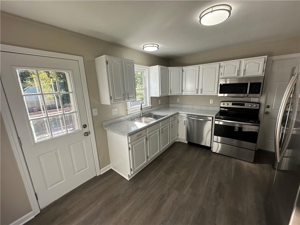 White kitchen and stainless steel appliances at 11113 E 25th Street, Independence, MO 64052
