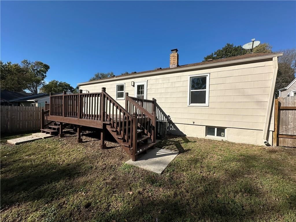 Deck, covered patio and wood fence at 11113 E 25th Street, Independence, MO 64052