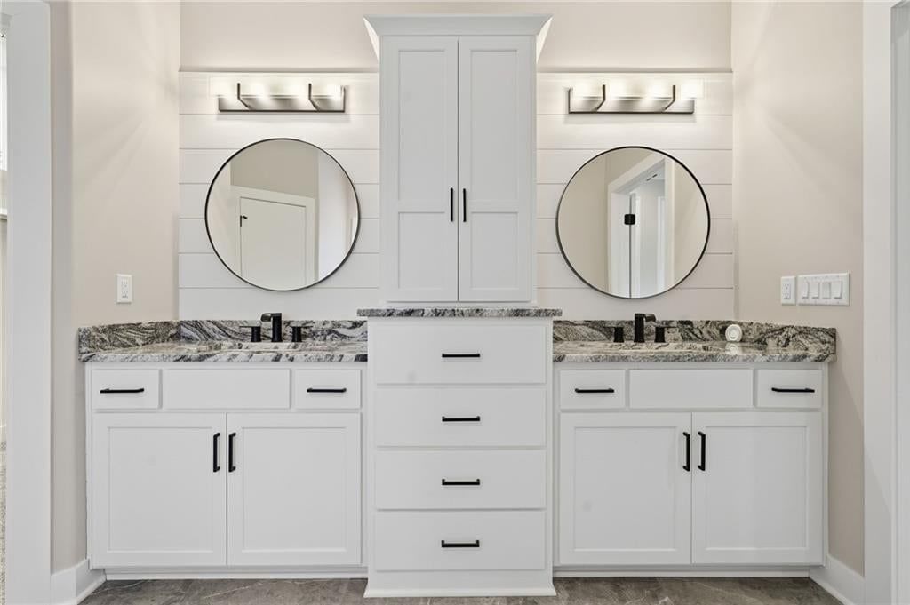 Double vanity, white vanity and renovated bathrooms at 1 S Buffalo Ridge Court, Lake Winnebago, MO 64034