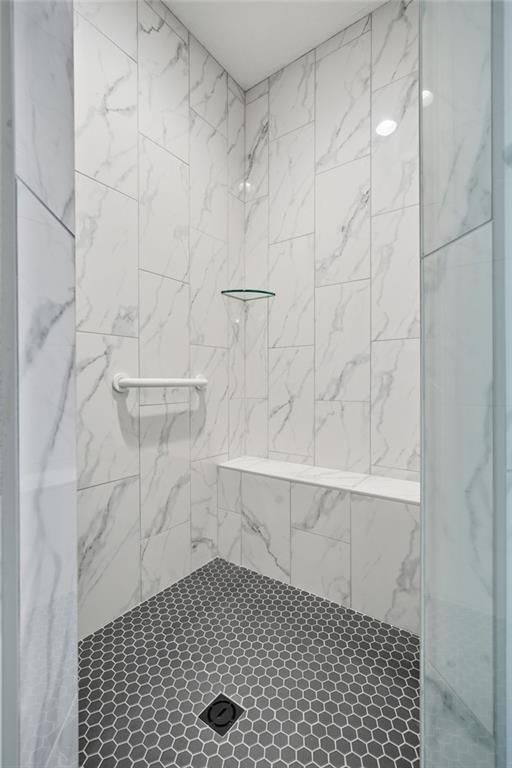 Walk-in shower, tiled shower and frameless glass shower at 1 S Buffalo Ridge Court, Lake Winnebago, MO 64034