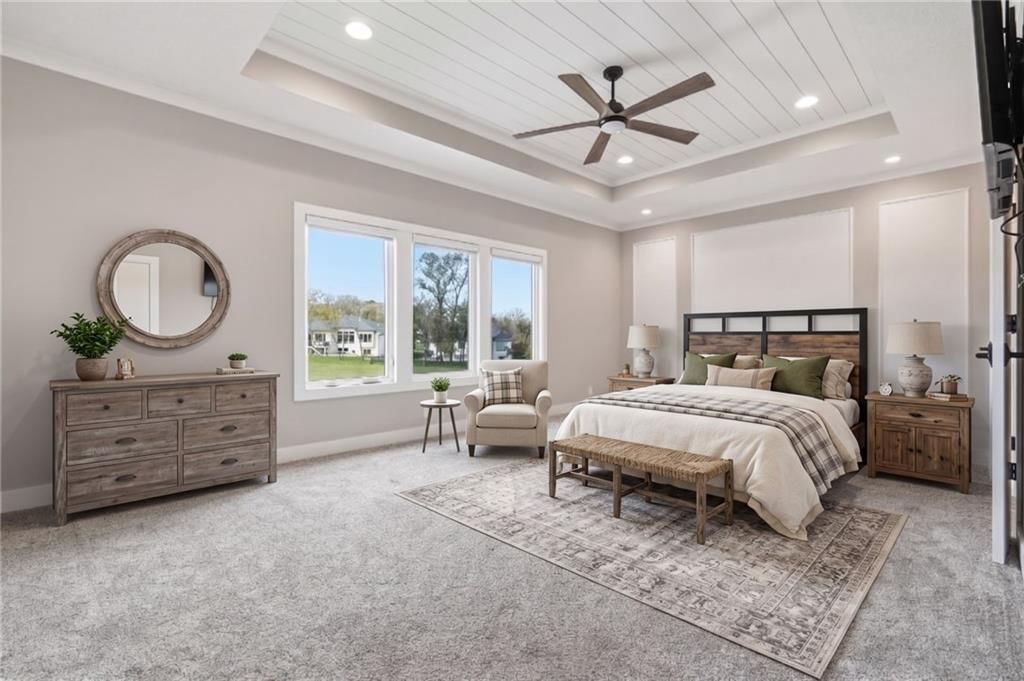 Main-floor primary bedroom and carpet at 1 S Buffalo Ridge Court, Lake Winnebago, MO 64034